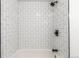 Clean bathroom with white subway tile and a shower/tub combo at 50 E Highline Cir # 102, Centennial, CO 80122