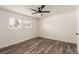Spacious bedroom featuring a ceiling fan and large window with blinds at 50 E Highline Cir # 102, Centennial, CO 80122