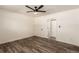 Well-lit bedroom with ceiling fan and access to hallway at 50 E Highline Cir # 102, Centennial, CO 80122