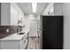 Modern kitchen with white cabinets and stainless steel appliances at 50 E Highline Cir # 102, Centennial, CO 80122