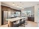 Modern kitchen with dark brown cabinets, white countertops, and an island at 5125 Vivian St, Wheat Ridge, CO 80033