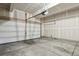 A spacious two-car garage featuring drywall and a concrete floor at 4770 N Jasper St, Denver, CO 80239