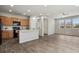 Modern kitchen with stainless steel appliances, center island, and wood cabinets at 4770 N Jasper St, Denver, CO 80239