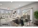Inviting living room bathed in natural light, complemented by a cozy dining area at 4770 N Jasper St, Denver, CO 80239