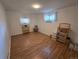 The basement has vinyl floors, white walls, two windows and shelves at 1245 S Forest St, Denver, CO 80246