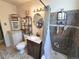 Bathroom with a shower, vanity, and decorative mirror, providing a functional and stylish space at 1245 S Forest St, Denver, CO 80246