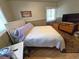 This bedroom offers a comfortable retreat with a large bed and relaxing atmosphere at 1245 S Forest St, Denver, CO 80246