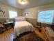 Cozy bedroom features hardwood floors, soft lighting, and a calming color scheme at 1245 S Forest St, Denver, CO 80246