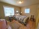 Comfortable bedroom with hardwood floors, natural light, and a calming color scheme, great for relaxation at 1245 S Forest St, Denver, CO 80246