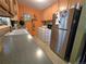 This kitchen features a light grey countertop, stainless steel refrigerator, and laundry appliances at 1245 S Forest St, Denver, CO 80246