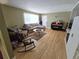 Inviting living room with hardwood floors, comfortable seating, and a piano; perfect for Gathering gatherings at 1245 S Forest St, Denver, CO 80246