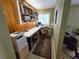 Cozy home office with built-in shelving, ample workspace, and natural light from the window at 1245 S Forest St, Denver, CO 80246