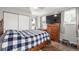 Comfortable bedroom with wood-look flooring, a large closet, and a ceiling fan at 235 N 7Th Ave, Brighton, CO 80601