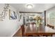 Open concept dining room showcasing hardwood floors and an adjacent gourmet kitchen at 235 N 7Th Ave, Brighton, CO 80601