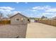 Back of house with detached garage and fenced yard at 235 N 7Th Ave, Brighton, CO 80601