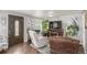 Cozy living room featuring hardwood floors, neutral paint, modern furnishings, and decor at 235 N 7Th Ave, Brighton, CO 80601