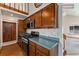 Kitchen with gas stove and ample counter space at 127 S Eagle Cir, Aurora, CO 80012