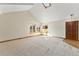 Spacious living room featuring vaulted ceilings and large windows at 127 S Eagle Cir, Aurora, CO 80012