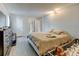 Cozy bedroom featuring neutral tones, wood floors, and bright natural light at 8600 E Alameda Ave # 17-105, Denver, CO 80247