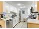 Updated kitchen featuring white cabinets, stainless steel appliances, and modern fixtures at 8600 E Alameda Ave # 17-105, Denver, CO 80247