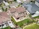 Aerial view of a residential home showcasing its well-manicured lawn, covered patio, and surrounding neighborhood at 2130 S Poppy St, Lakewood, CO 80228