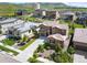 Beautiful aerial view of home with lush landscaping, a well-manicured lawn, and convenient front driveway at 2130 S Poppy St, Lakewood, CO 80228