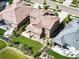 High-angle view showcasing a landscaped backyard, patio area, and garden beds of a two-story home at 2130 S Poppy St, Lakewood, CO 80228