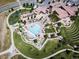 Community clubhouse aerial view showcasing the pool, lounge areas, solar panels, and meticulously maintained landscaping at 2130 S Poppy St, Lakewood, CO 80228