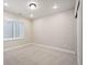 Neutral bedroom featuring a plush carpet and an abundance of natural light at 2130 S Poppy St, Lakewood, CO 80228