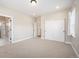 Bedroom with a carpeted floor, multiple closets and white trim at 2130 S Poppy St, Lakewood, CO 80228