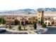 Elegant community clubhouse boasting striking architecture and lush landscaping against a scenic mountain backdrop at 2130 S Poppy St, Lakewood, CO 80228
