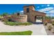 Stone community entrance with landscaped beds, arched entryway and community signage, giving a stately welcome at 2130 S Poppy St, Lakewood, CO 80228