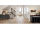 The entryway features a hardwood floor, natural light, and modern decor at 2130 S Poppy St, Lakewood, CO 80228