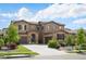 Beautiful two-story home featuring a well-manicured lawn and a spacious driveway leading to two garages at 2130 S Poppy St, Lakewood, CO 80228