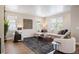 Comfortable living room with neutral tones, large windows, and stylish furnishings at 2130 S Poppy St, Lakewood, CO 80228