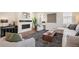 Well-lit living space with fireplace, stylish decor, and plenty of natural light at 2130 S Poppy St, Lakewood, CO 80228