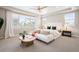 Spacious main bedroom features tray ceiling, ceiling fan, and large windows with neighborhood views at 2130 S Poppy St, Lakewood, CO 80228