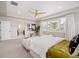 Elegant main bedroom with large windows, sitting area, and ensuite bathroom access at 2130 S Poppy St, Lakewood, CO 80228