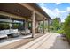 Covered patio offers an inviting outdoor living space with comfortable seating and dining areas at 2130 S Poppy St, Lakewood, CO 80228