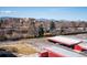 Scenic aerial view featuring neighborhood, buildings, mountains, and carport parking at 7801 W 35Th Ave # 405, Wheat Ridge, CO 80033