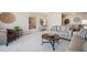 Cozy living room with carpet, neutral walls, comfortable furniture, and decorative wall hangings at 7801 W 35Th Ave # 405, Wheat Ridge, CO 80033