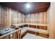 Wood-paneled sauna equipped with tiered seating and a rock-filled heater for relaxation at 7801 W 35Th Ave # 405, Wheat Ridge, CO 80033
