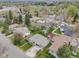 A peaceful residential neighborhood featuring tidy fenced yards and mature trees at 7160 W 24Th Ave, Lakewood, CO 80214