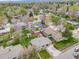 Overhead view of a residential neighborhood with well-maintained homes and lush green trees at 7160 W 24Th Ave, Lakewood, CO 80214
