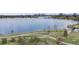 Scenic aerial view of a serene lake with a city skyline in the distance at 7160 W 24Th Ave, Lakewood, CO 80214