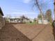 Fenced in backyard with deck, shed, lawn, and woodchips at 7160 W 24Th Ave, Lakewood, CO 80214