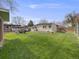 Backyard with green grass, firepit, shed, and fenced in area at 7160 W 24Th Ave, Lakewood, CO 80214