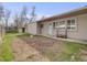 Backyard with freshly tilled soil, shed, and wood storage at 7160 W 24Th Ave, Lakewood, CO 80214