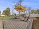 Wooden deck featuring outdoor seating and shade umbrella at 7160 W 24Th Ave, Lakewood, CO 80214