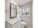 Bathroom with granite countertops, a large mirror, and ample lighting at 7160 W 24Th Ave, Lakewood, CO 80214